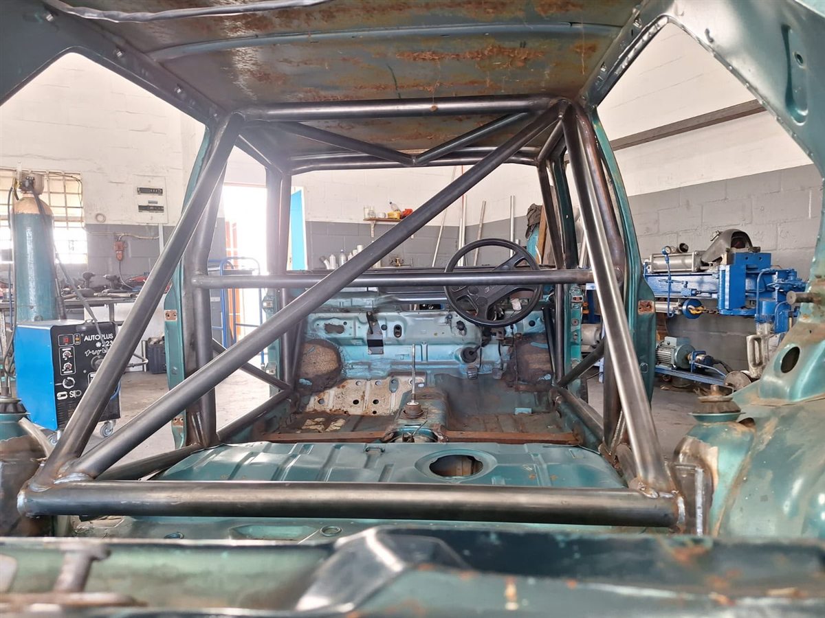 Roll cage welded into a stripped shell
